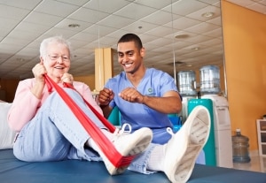 Physical therapist working with patient
