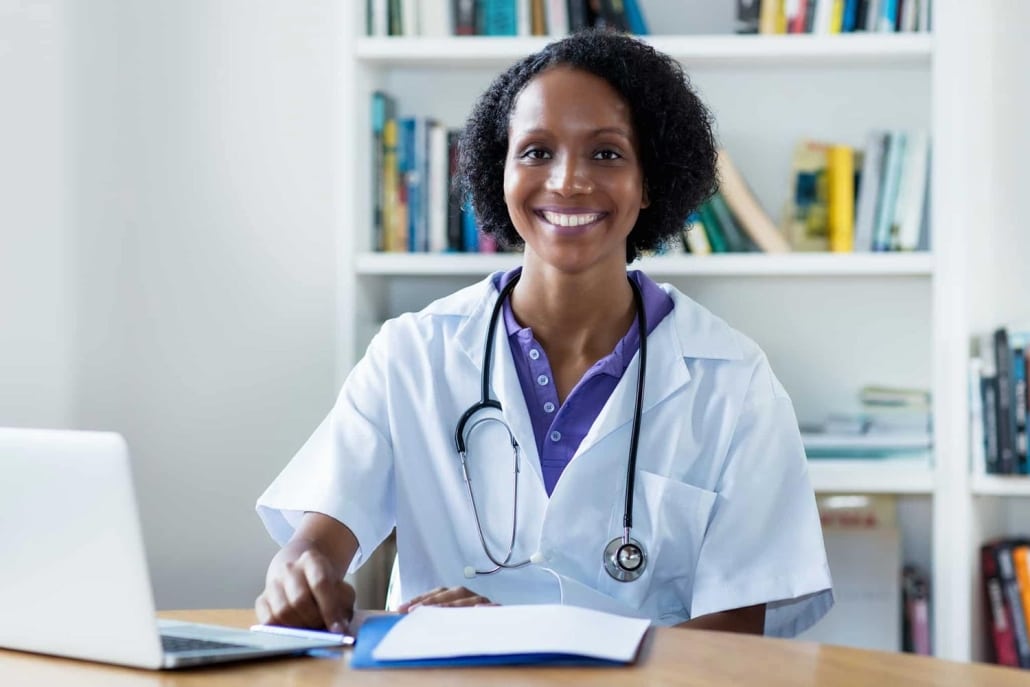 African-American medical professional using a laptop